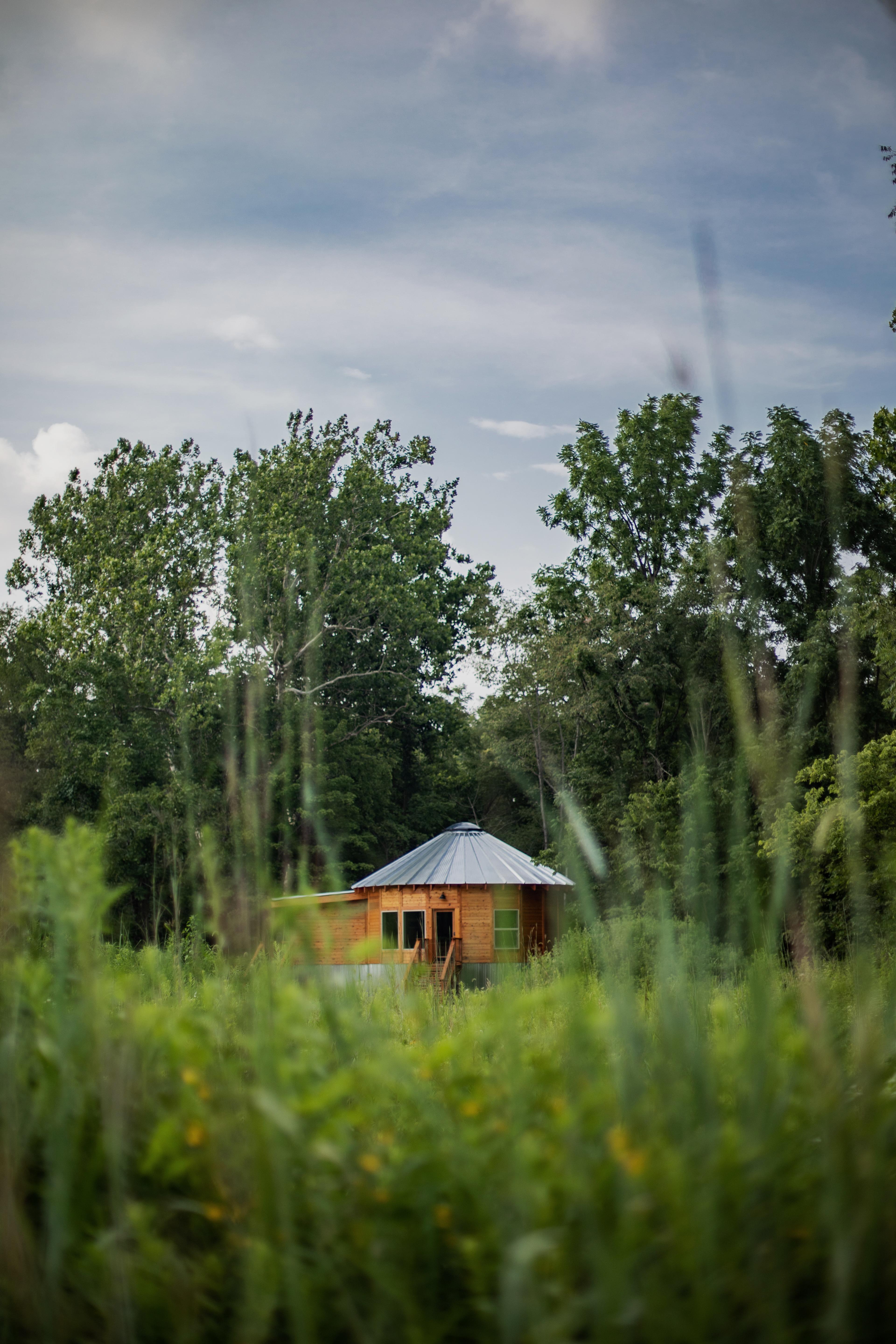 Wooden yurt in a field
